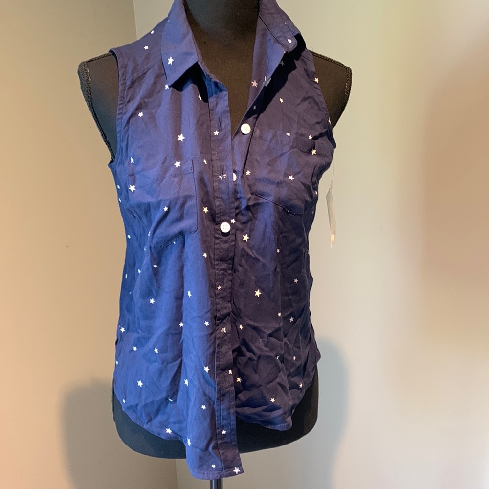 Women’s SO sleeveless top navy with white stars. NWT size xs.